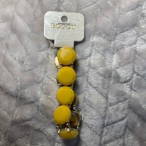 Chunky yellow bracelet with gold detailing